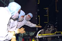 Astronauts preparing for the challenging tasks to be performed during Servicing Mission 3B.